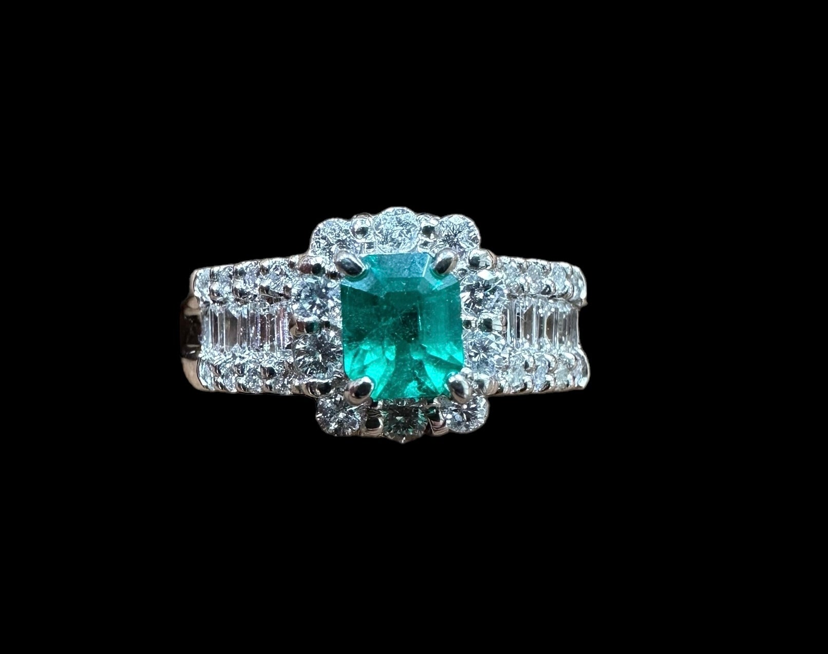 0.49ct Colombian Emerald Ring with surrounding 0.69ct Baguette & Brilliant Round Diamonds set in Platinum