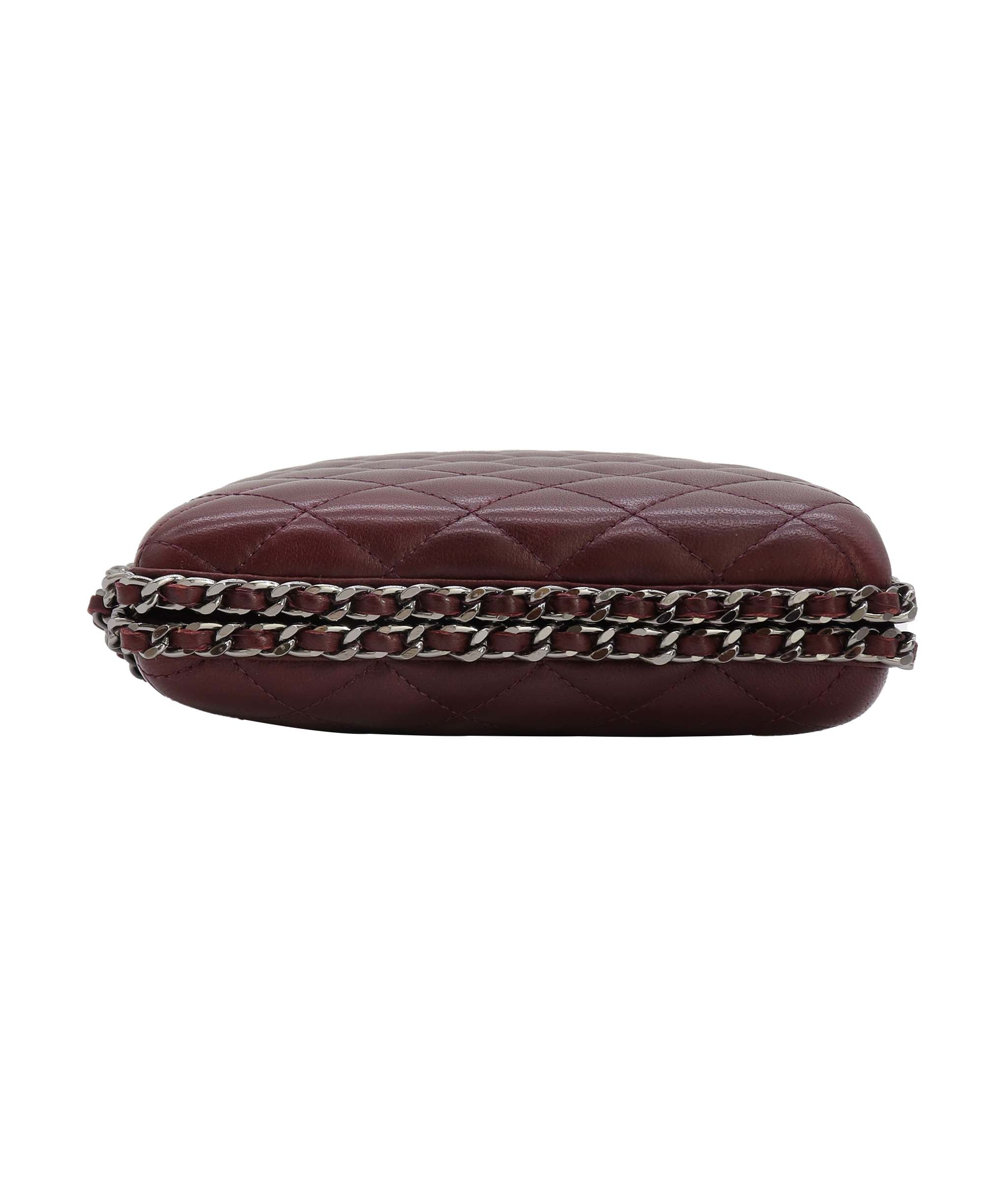 Chanel burgundy quilted clutch with crossbody strap