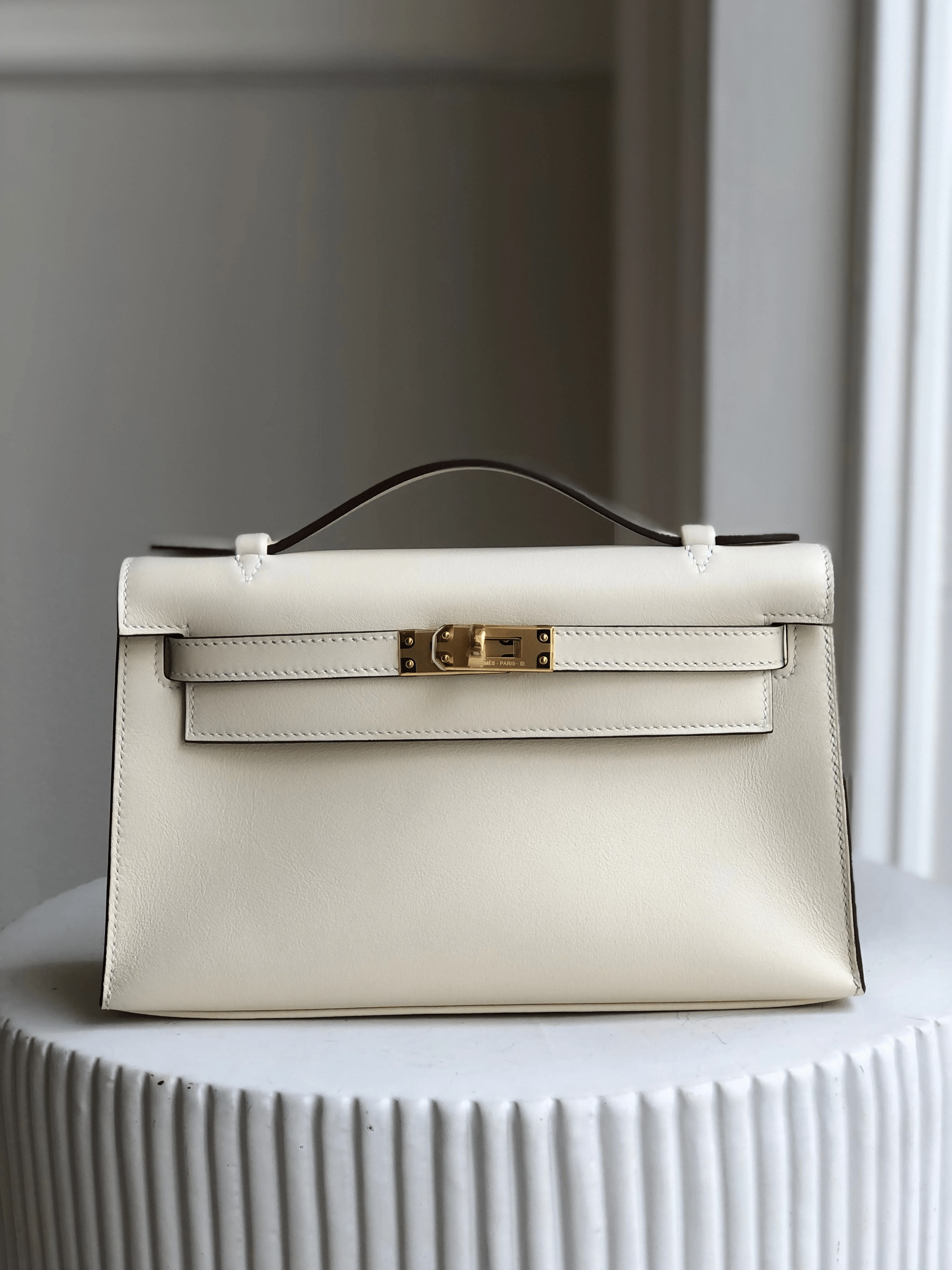 Hermes HERMÈS KELLY POCHETTE NATA Swift Leather with Gold Hardware