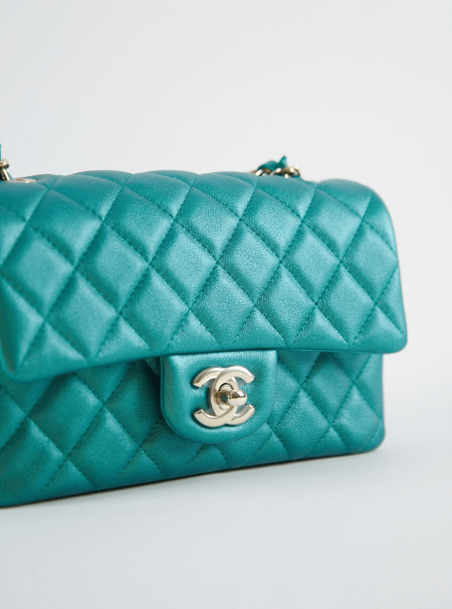 LuxuryVault CHANEL MINI FLAP BAG PEARLESCENT GREEN Lambskin Leather with Champagne Hardware