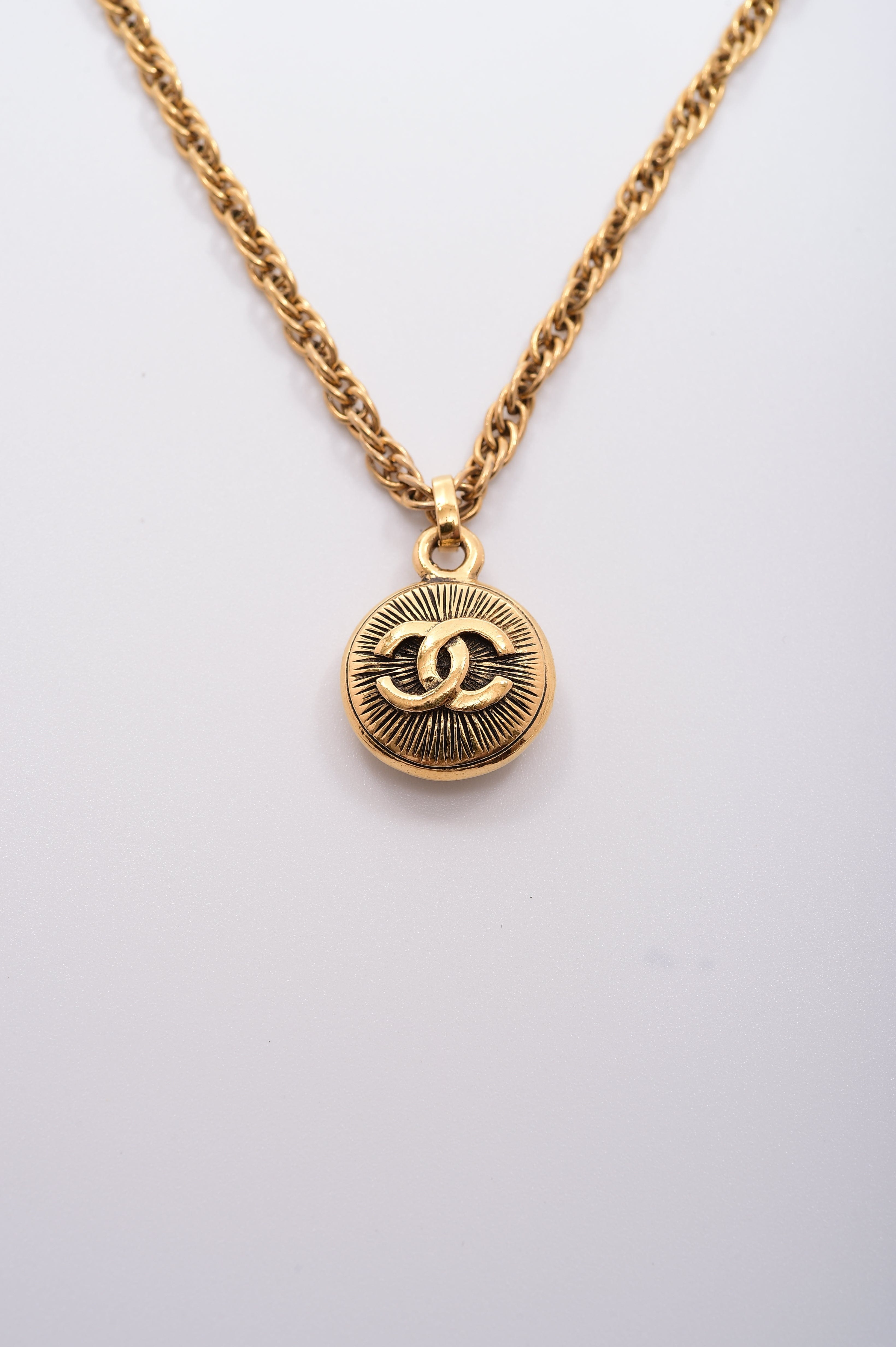 Chanel Chanel Double-Sided Small Sunburst Pendant Necklace ASL4346