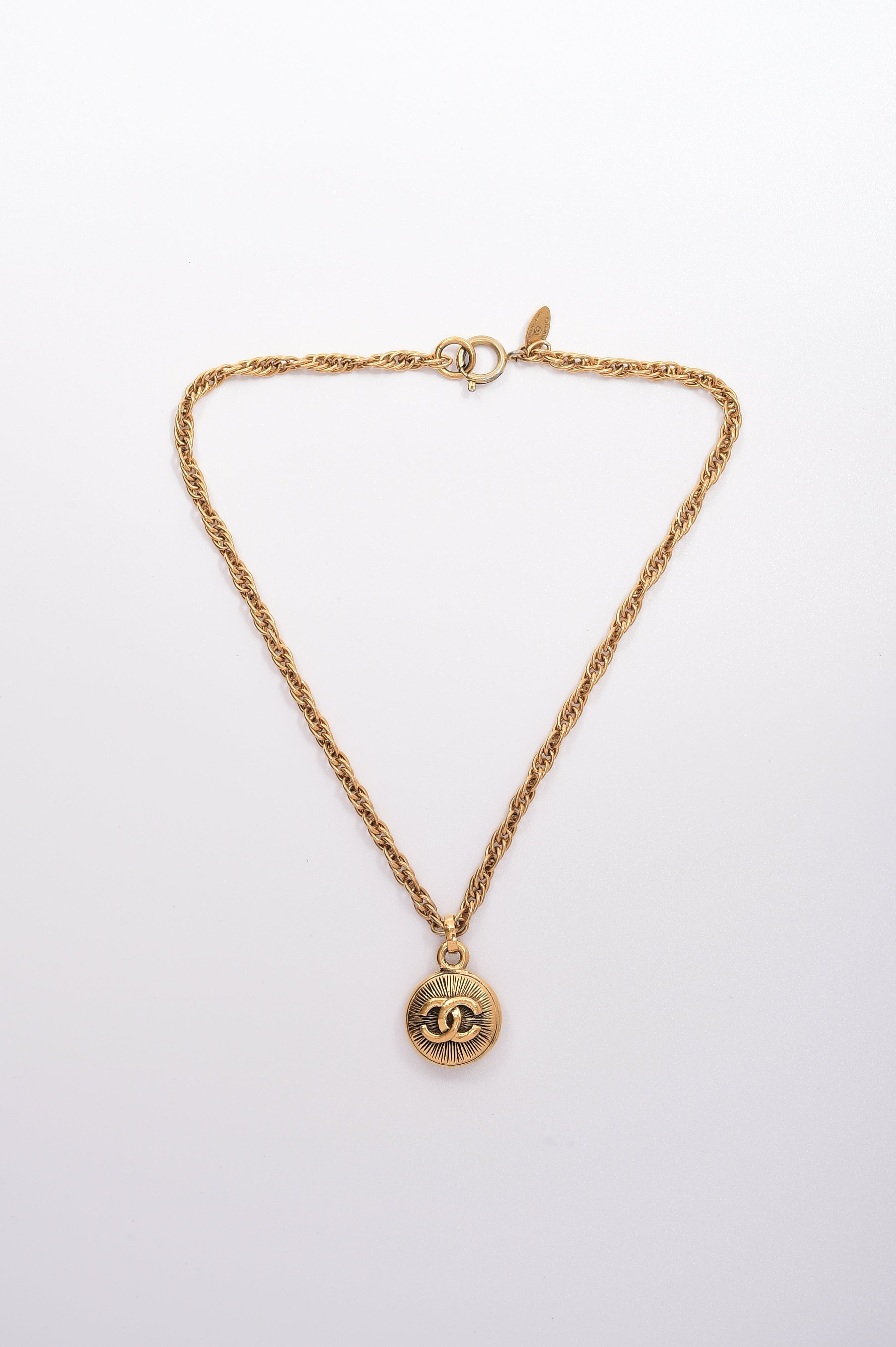 Chanel Chanel Double-Sided Small Sunburst Pendant Necklace ASL4346