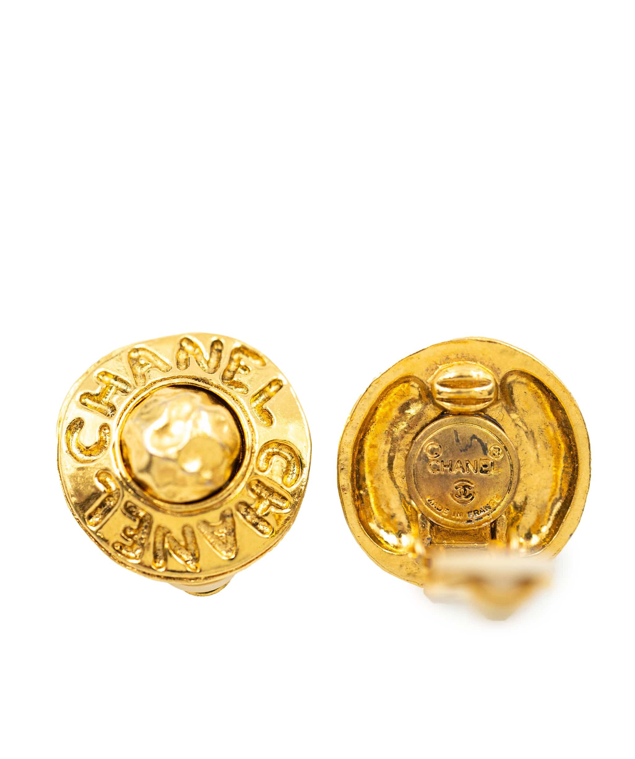 Chanel Chanel small round clip-on earrings with hammered centre and "CHANEL" embossed around AEL1062