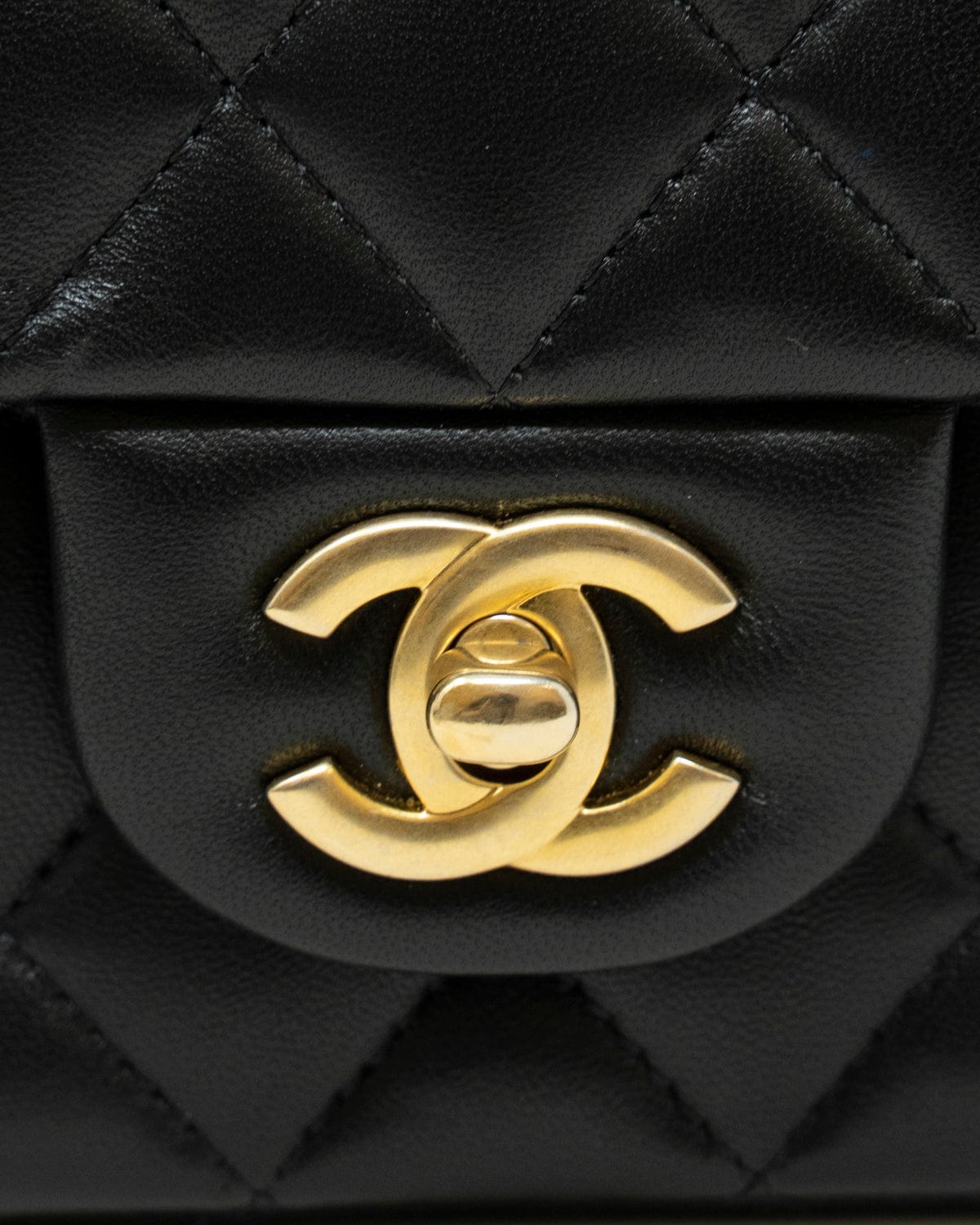 Chanel Chanel mini coco top handle in black lambskin with champagne gold hardware. ASL3320